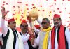 Samajwadi Party President Akhilesh Yadav being presented a memento by party members during an election rally in Sandila on Monday. (UNI)