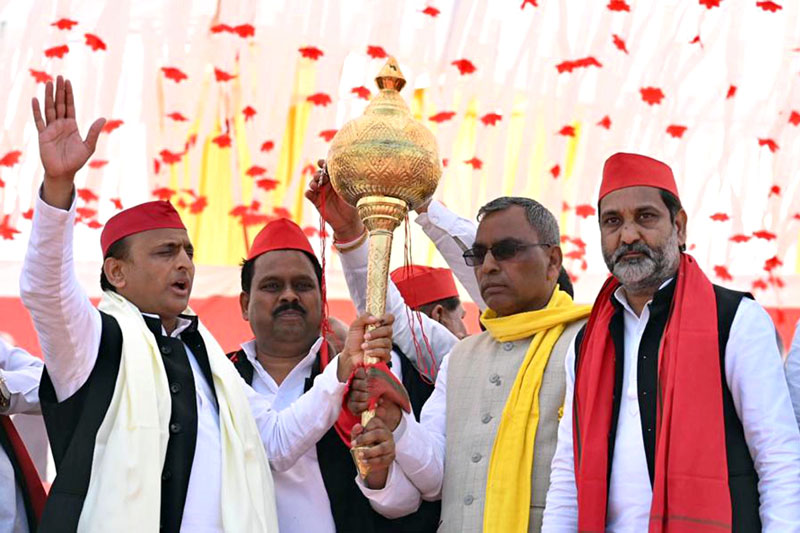 Samajwadi Party President Akhilesh Yadav being presented a memento by party members during an election rally in Sandila on Monday. (UNI)