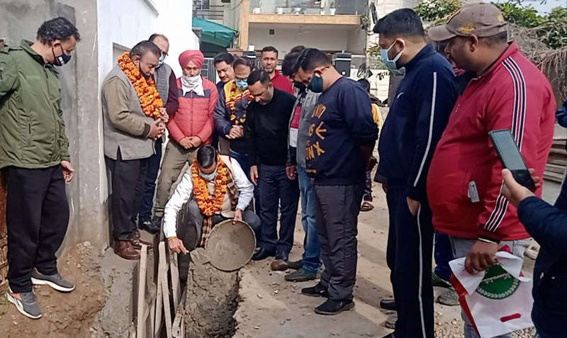 page8-4 Corporator Sanjay Baru kick starting construction of drain at Hazuri Bagh Bohri on Monday.