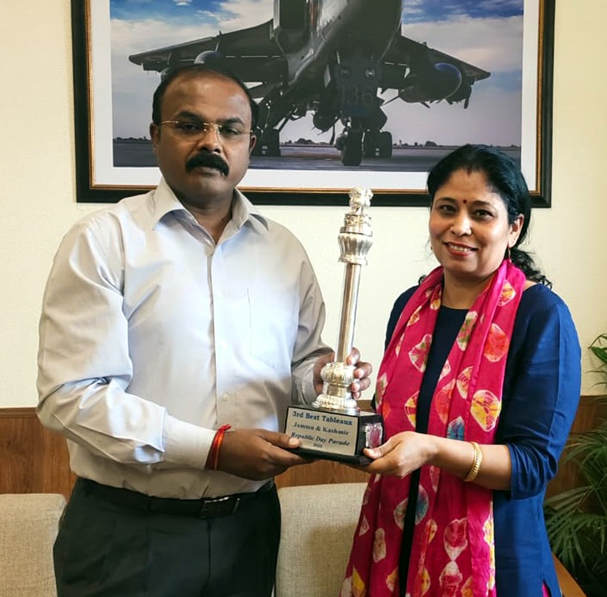 An officer of J&K receiving and award. An officer of J&K receiving and award.