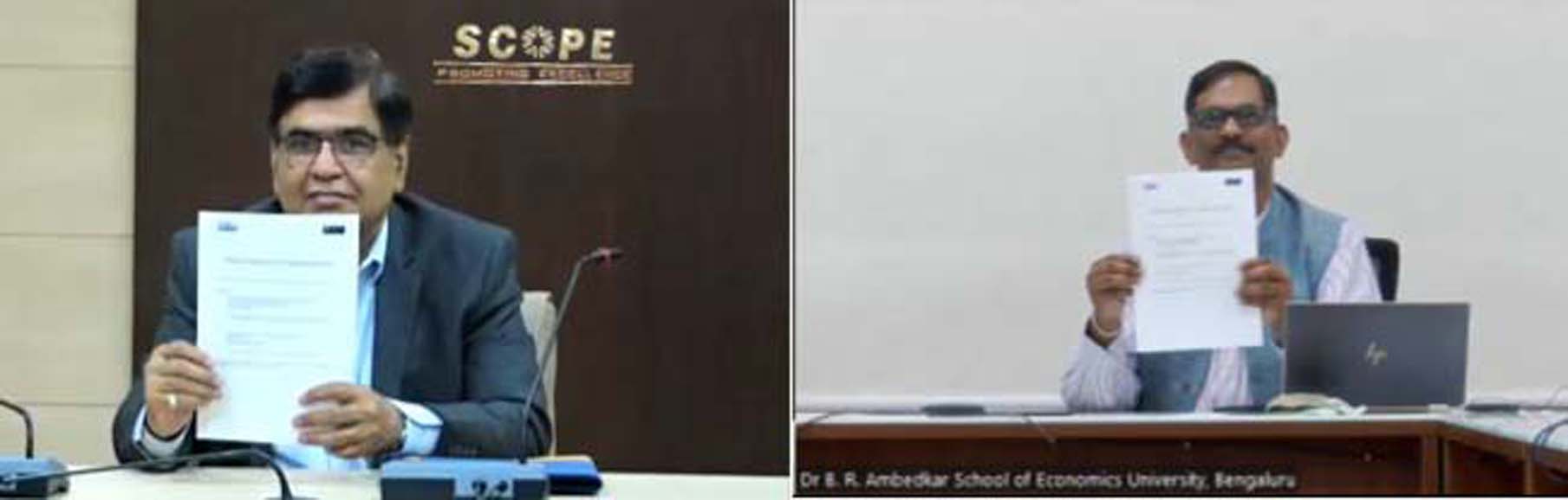 Atul Sobti and NR Bhanumurthy displaying copies of MoU signed between SCOPE and Ambedkar School of Economics University. Atul Sobti and NR Bhanumurthy displaying copies of MoU signed between SCOPE and Ambedkar School of Economics University.