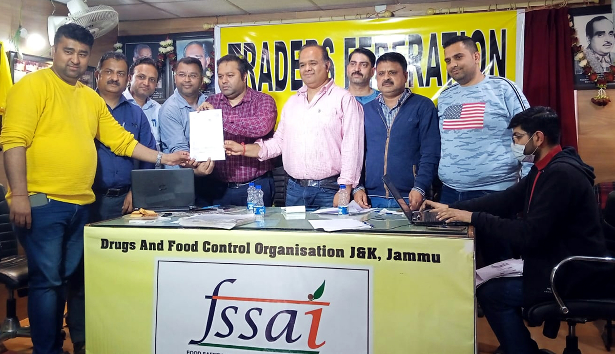 Officers of Food Safety Wing of Drugs and Food Control Organization issuing license to a Food Business Operator in presence of office bearers of Traders Federation Ware House Nehru Market Jammu. Officers of Food Safety Wing of Drugs and Food Control Organization issuing license to a Food Business Operator in presence of office bearers of Traders Federation Ware House Nehru Market Jammu.