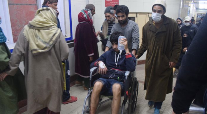 A civilian injured in grenade attack being shifted to SMHS hospital in Srinagar. — Excelsior/Shakeel