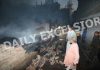 Fire fighters extinguish flames at Residency Road in Jammu on Monday. -Excelsior/Rakesh