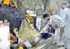 A priest performing Pooja of holy Shiva Lingam inside shrine of Shiv Khori in Reasi district. -Excelsior/Romesh Mengi