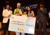 Lieutenant Governor Manoj Sinha presenting cheque in presence of senior officers in Jammu on Monday.
