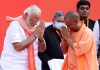 Uttar Pradesh Chief Minister Yogi Adityanath greeting Prime Minister Narendra Modi after taking oath in Lucknow on Friday. (UNI)