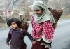 Children carrying firewood head home in Bhaderwah area of Doda district.