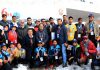 Winners displaying medals while posing with dignitaries at Gulmarg on Sunday.