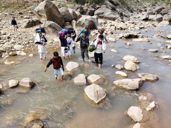 Locals crossing water filled Nallah in absence of a bridge. — Excelsior/K Kumar Locals crossing water filled Nallah in absence of a bridge. — Excelsior/K Kumar