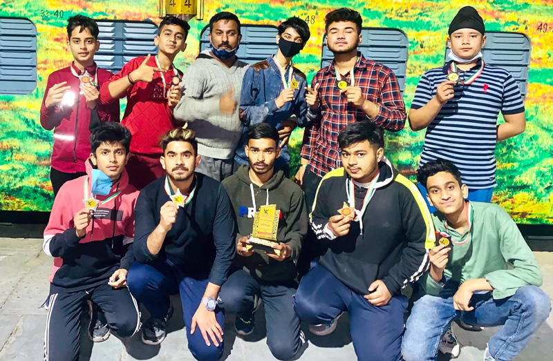 page12-2 Medallists displaying medals and trophies on Wednesday.