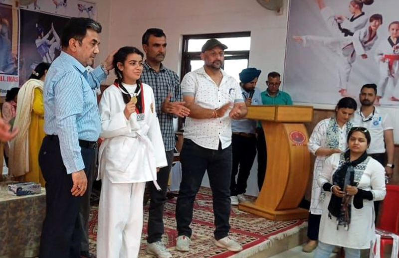 Director YS&S, Gazanfar Ali awarding a winner at Khel Gaon Nagrota on Thursday. Director YS&S, Gazanfar Ali awarding a winner at Khel Gaon Nagrota on Thursday.