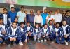 Wrestlers posing for a group photograph with Ashok Singh, Divisional Sports Officer (J) and others at Jammu.