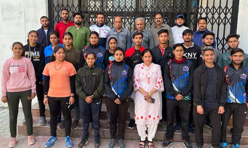 Selected team players posing for a group photograph with Divisional Sports Officer, Ashok Singh and others at Jammu. Selected team players posing for a group photograph with Divisional Sports Officer, Ashok Singh and others at Jammu.