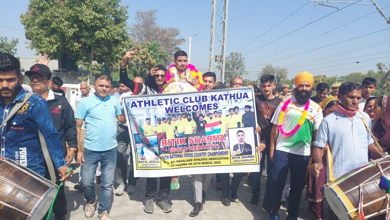 Gold medallist Ritik Sharma receiving a rousing welcome at Railway Station Kathua on Wednesday.