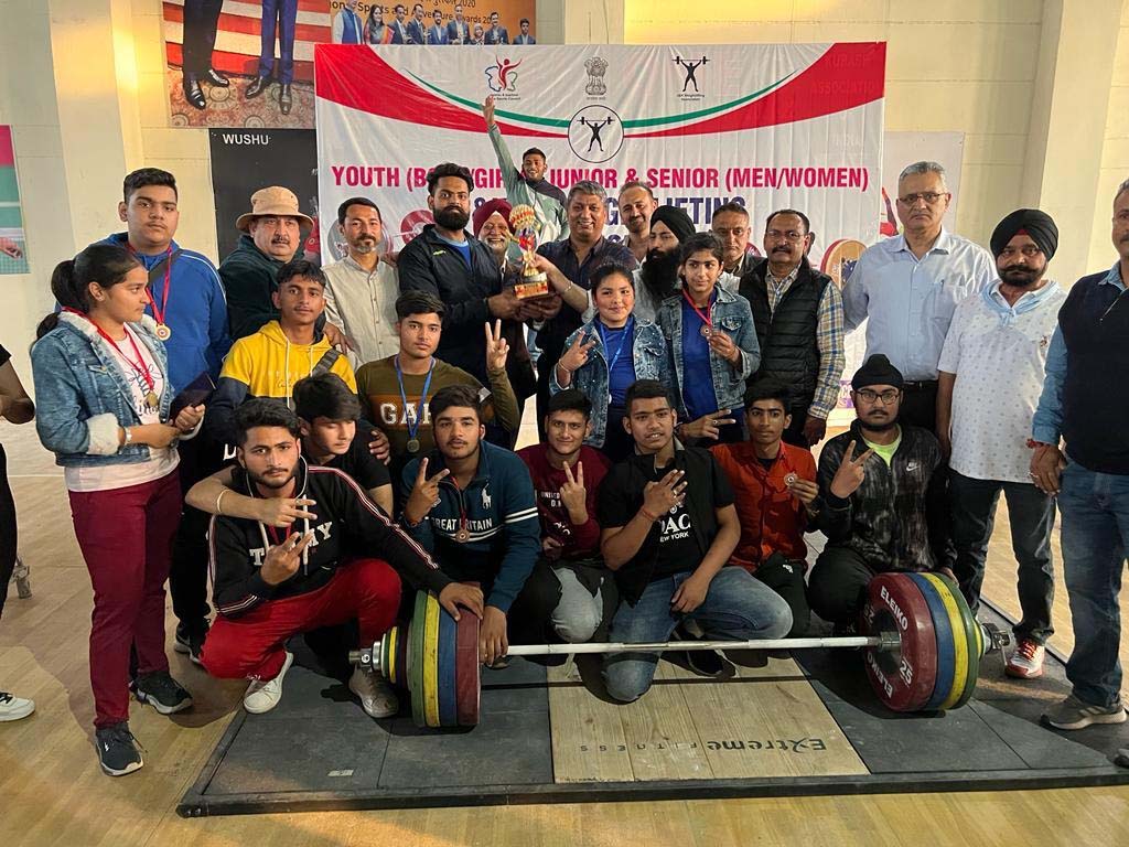 page12-8 Winners displaying trophy while posing with dignitaries at Bhagwati Nagar, Jammu on Saturday.