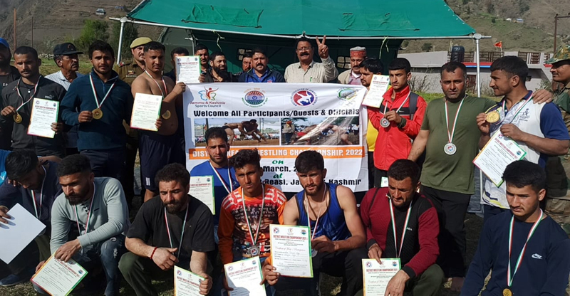 Winners displaying medals and certificates while posing with dignitaries at Reasi on Monday. Winners displaying medals and certificates while posing with dignitaries at Reasi on Monday.