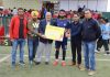 A player being awarded with Man of Match award by dignitaries at Synthetic Turf TRC Srinagar.