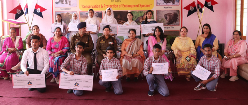 Winners displaying meritorious certificates while posing with dignitaries at Jammu on Monday. Winners displaying meritorious certificates while posing with dignitaries at Jammu on Monday.