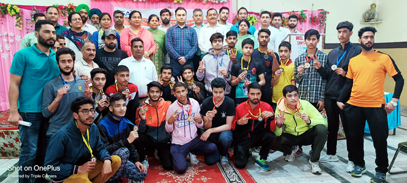 Winners displaying medals while posing with dignitaries at Reasi on Wednesday. Winners displaying medals while posing with dignitaries at Reasi on Wednesday.