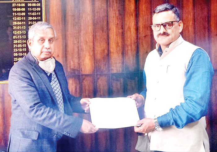 BJP leader, Sanjay Baru handing over land acquisition papers to Rajan Mengi, CE, PMGSY at Jammu on Saturday. BJP leader, Sanjay Baru handing over land acquisition papers to Rajan Mengi, CE, PMGSY at Jammu on Saturday.