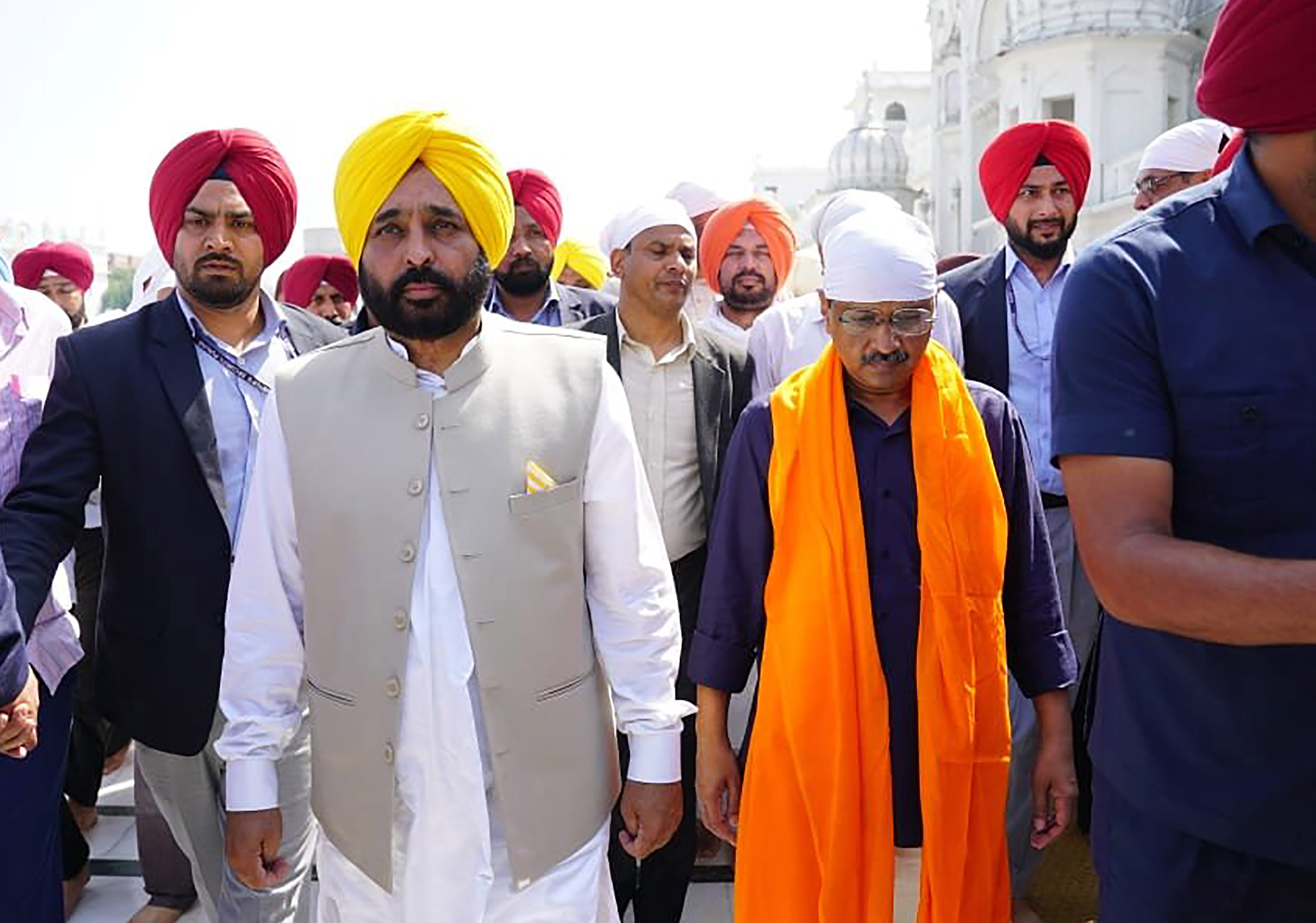 Delhi Chief Minister Arvind Kejriwal and Punjab CM designate Bhagwant Mann visit the Golden Temple in Amritsar on Sunday. (UNI)