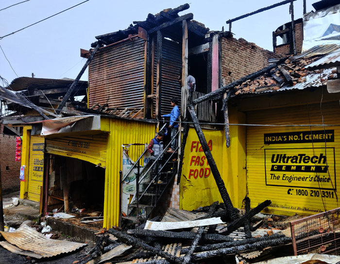 A view of triple storey building gutted in fire. —Excelsior/Tilak Raj A view of triple storey building gutted in fire. —Excelsior/Tilak Raj