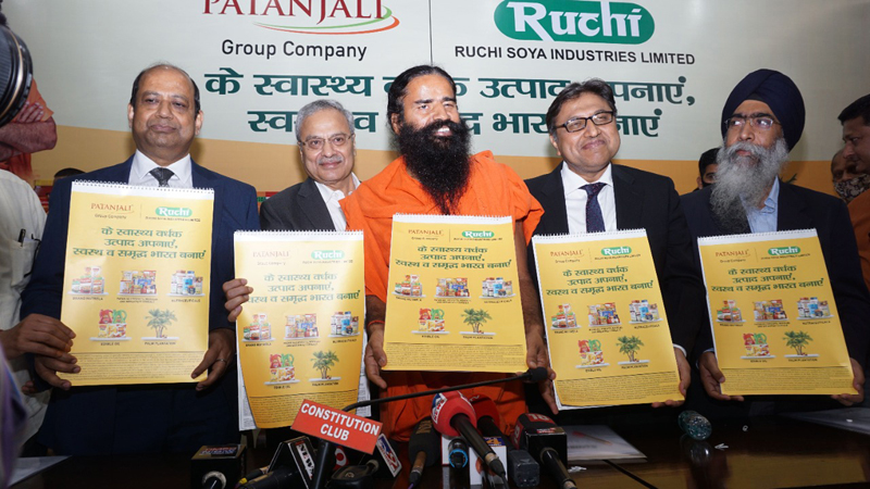 Yog Guru Baba Ramdev and officials of Ruchi Soya Industries Limited posing for group photograph. Yog Guru Baba Ramdev and officials of Ruchi Soya Industries Limited posing for group photograph.
