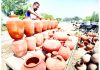 A vendor displays clay water pots on Akhnoor road in Jammu. —Excelsior/Rakesh