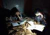 Students finding it tough to study as electricity remains off in Bhaderwah. -Excelsior/Tilak Raj