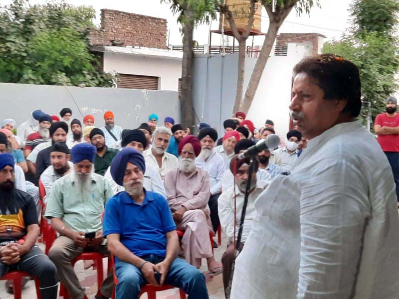 Cong Working president Raman Bhalla addressing public meeting in Simbal Camp area of Jammu South. Cong Working president Raman Bhalla addressing public meeting in Simbal Camp area of Jammu South.