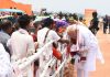 Prime Minister Narendra Modi receives traditional welcome during his visit to Karbi Anglong district, Assam on Thursday. (UNI)