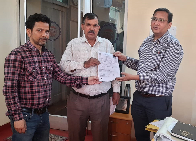 EPFO officers handing over pension claim settlement document to a pensioner. EPFO officers handing over pension claim settlement document to a pensioner.