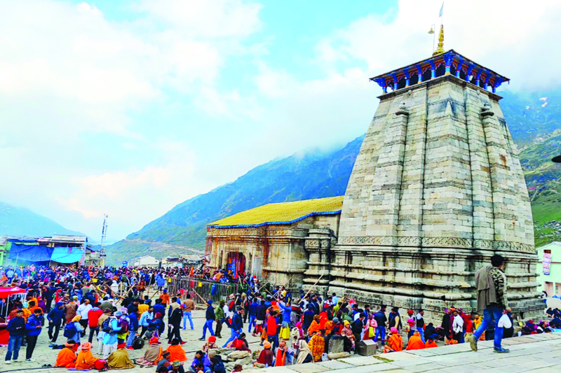 Devotees waiting in queue for their turn to have a darshan of Bhagwan Kedarnath at Kedarnath temple on Wednesday. (UNI)