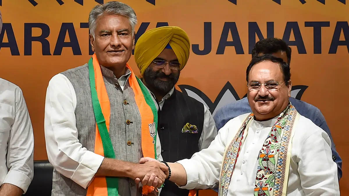 Former Punjab Congress President Sunil Jakhar being greeted by BJP President J P Nadda as he joins the party at the BJP headquarters, in New Delhi