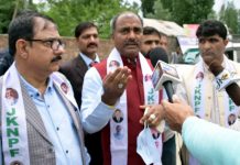 JKNPF chairman Sanjay Kumar interacting with media during a party convention at Pulwama.