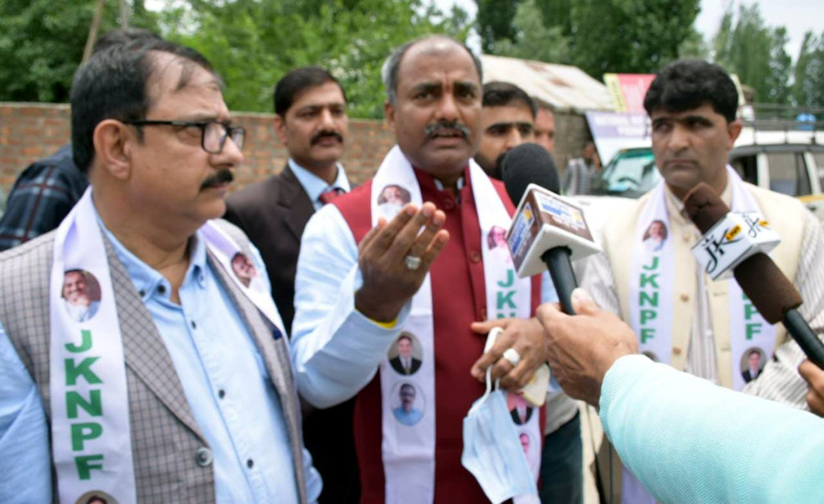 JKNPF chairman Sanjay Kumar interacting with media during a party convention at Pulwama.