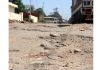 Damaged road near RTO office in Narwal area of Jammu. - Excelsior/Rakesh