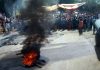 People block Jammu-Poonch highway near Sunderbani on Wednesday.