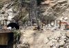JCBs engaged in removing debris near Khooni Nallah in district Ramban. -Excelsior/Parvaiz