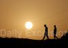 People walk on a hill during Sunset in Mendhar. — Excelsior/Rahi Kapoor