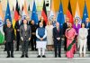 Prime Minister Narendra Modi, German Chancellor Olaf Scholz and the high-level official delegations assisting the two leaders to represent India and Germany respectively pose for a group photograph at the Federal Chancellery in Berlin on Monday.