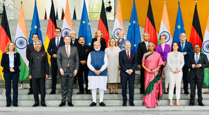 Prime Minister Narendra Modi, German Chancellor Olaf Scholz and the high-level official delegations assisting the two leaders to represent India and Germany respectively pose for a group photograph at the Federal Chancellery in Berlin on Monday.