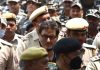 JKLF chief Yasin Malik being escorted by security personnel at Patiala House court in New Delhi on Wednesday. (UNI)