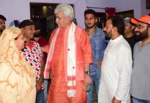 Lt Governor Manoj Sinha interacting with family members of Cricketer Umran Malik at Jammu on Tuesday.
