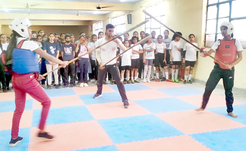 Players in action during Silambam Martial Arts at Jammu on Thursday.