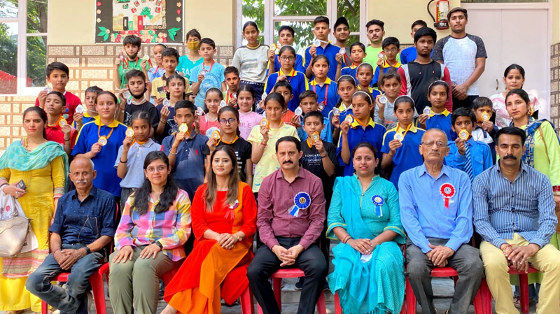 Winners displaying medals while posing with dignitaries at Jammu on Monday. Winners displaying medals while posing with dignitaries at Jammu on Monday.