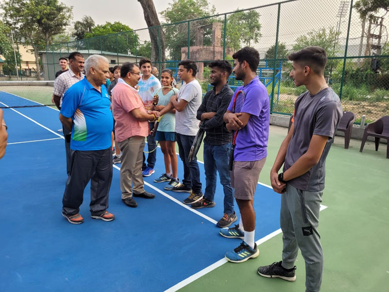 Former MLC Vikram Randhawa interacting players at MA Stadium on Sunday.