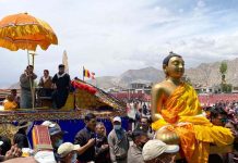 People including monks carrying the statue of Lord Buddha and Sungchos (holyscriptures) during a religious procession in Leh. -Excelsior/Morup Stanzin
