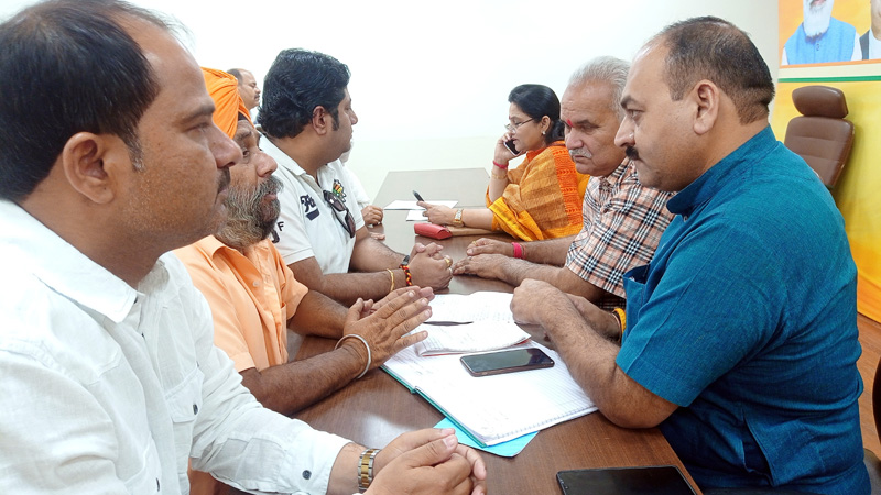 BJP leaders listening public grievances at Party office Jammu on Friday. BJP leaders listening public grievances at Party office Jammu on Friday.
